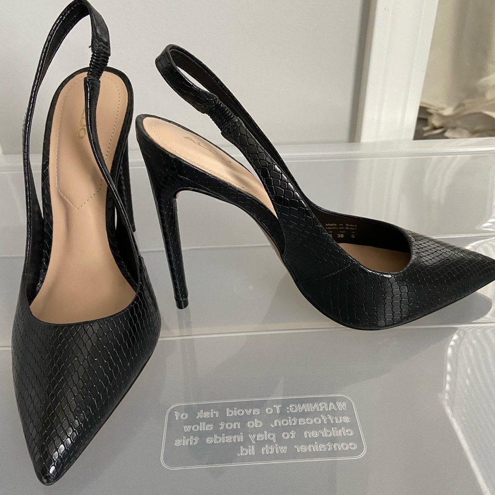 Black sling back Aldo heel.